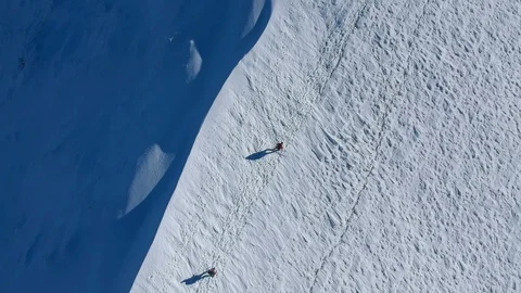 Climbing up on the mountain at winter Stock Footage 99425496