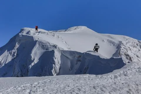 Climbing on mountain in winter Stock Photos