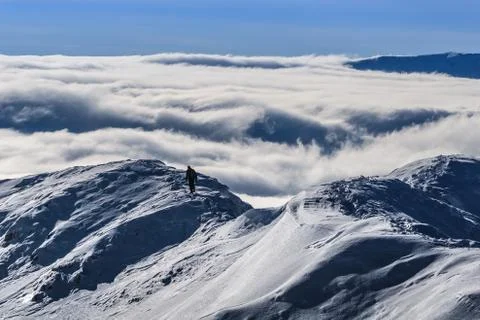 Climbing the mountain in winter Stock Photos