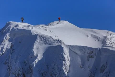 Climbing on mountain in winter Stock Photos