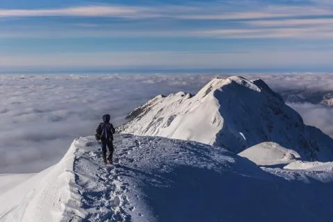 Climbing on mountain in winter Stock Photos