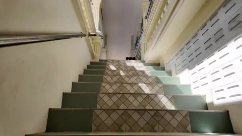 Climbing the path of elevation: first-person ascent of the stairs Video stock 308343371