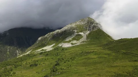 Climbing a peak wrapped in a cloud Stock Footage 138881326