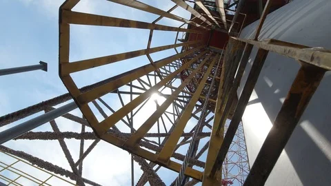 Climbing up the rig crane from the ladder Stock Footage 120227085