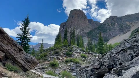 Climbing the Rock Pile at Moraine Lake Stock Footage