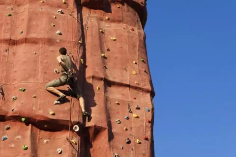 Climbing a rock wall. Stock Photos