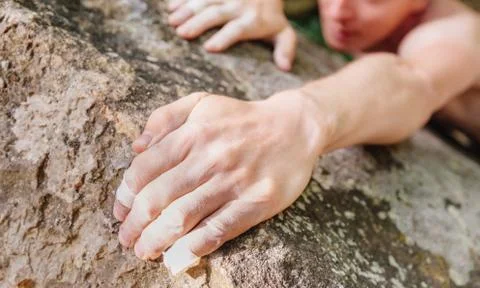 Climbing on rock wall. Stock Photos