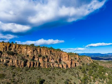 Climbing rocks and exploring a mountain range in a clear sky during the day.. Stock Photos