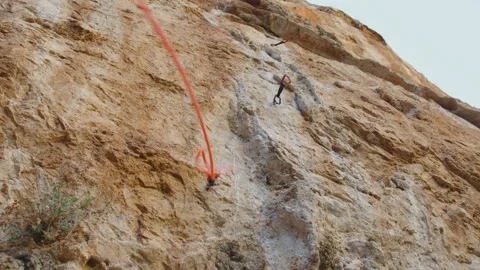 Climbing rope descending the cliff in quickdraws, Mallorca, Spain Stock Footage 288438634