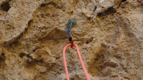 Climbing rope descending the cliff in quickdraws, Mallorca, Spain Stock Footage 288438646