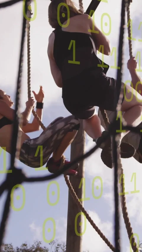 Climbing ropes, people with binary code overlay, focusing on teamwork and Stock Footage 319265099