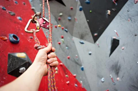 Climbing. A safety bolt threaded a rope with a carbine. Granite wall Stock Photos