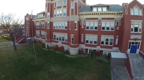 A climbing shot of an old brick school building Stock Footage 43346287