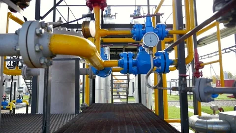 Climbing stairs to control the gas drying station Stock Footage 142495867