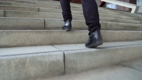 Climbing a stairs, low angle shot. Stock Footage 84891807