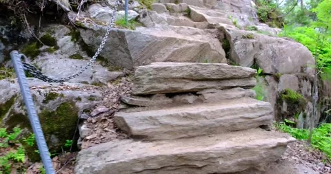 Climbing the steep stone steps to the mountain Stockbeeldmateriaal 142727479