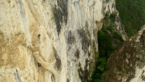 Climbing Together: Overcoming Challenges and Conquering New Heights 스톡 동영상 257239143