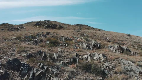 Climbing to the top of the mountain Видео 250082204