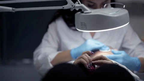 In the clinic, the cosmetologist does the client a mechanical facial cleansing Vídeo Stock 81637141