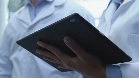Clinic scientists working tablet typing experiment results, laboratory research Stock-Footage 118910810