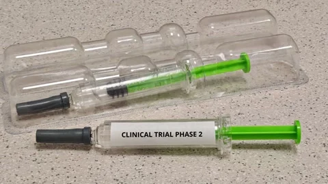 CLINICAL TRIAL PHASE 2 concept for clinical evaluation of syringe-administered Stock Footage 347026321
