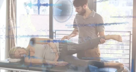 Clinician performing Ober test on table with sidelying patient lifting leg Stock Footage 330144133