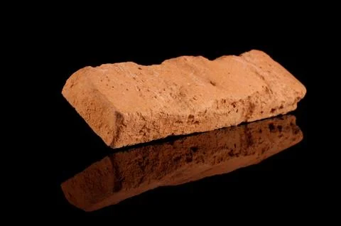 Clinker brick isolated on the black Fotos de archivo