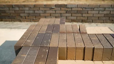 Clinker bricks showing different colors laying on pallet during construction Stock Photos