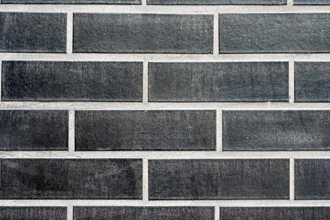 Clinkered wall with black bricks Stock Photos