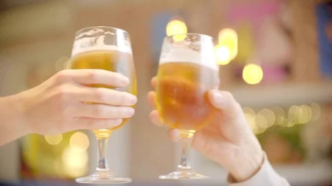 Clinking glasses with beer in bar Stock Footage 72494038