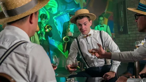 Clinking glasses of whiskey Stock Footage 112185327