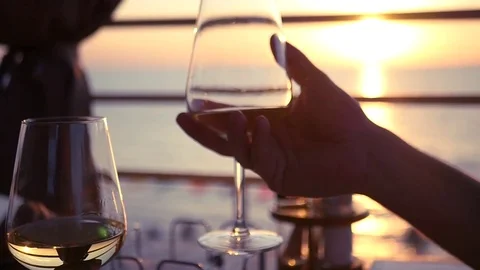 Clinking glasses with white wine at sunset. HD, 1920x1080. slow motion Stock Footage 80517604