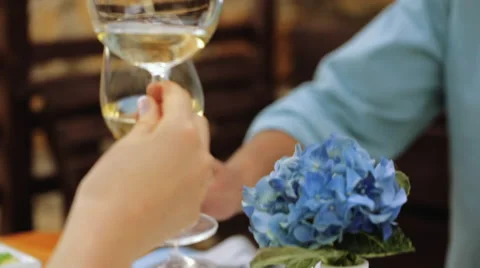 Clinking glasses with white wine toast cheers Stock Footage