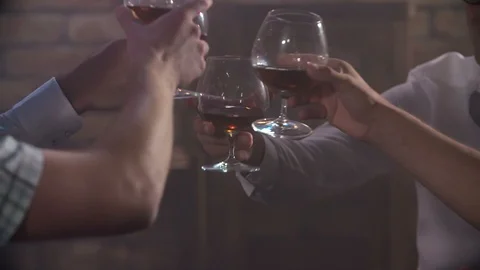 Clinking their glasses with whisky  Stock Footage 112196958