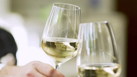 Clinking wine glasses light background day calm wedding celebration couple date Stock Footage 96768843