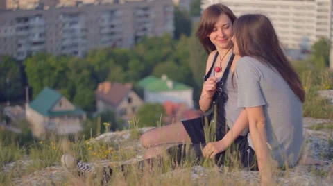 CLIP EDIT Happy young man and woman in love licking lollipop outdoors Stock-Footage 8367076