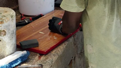 A clip of a man cleaning fish.  Video stock 246771542