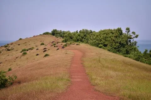 Clip of a mountain with small path just beside chapora fort in goa Stock Photos