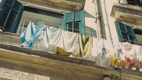 Clip of an open window with clothes put to dry outside. Stock Footage 92713680