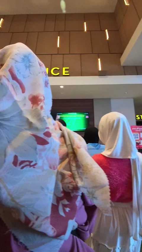 Clip of people queuing at a cinema ticket office Stock Footage 327650971