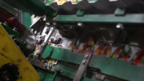 This clip showcases a high-speed packaging machine with exact movements. The Stock Footage 332227570