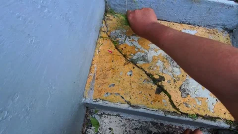 Clip showing weed removal on the front steps Stock Footage 332124256
