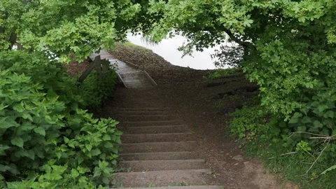 A clip of steps doing down to the valley of Aylestone Meadow Leicester, UK. Stock Footage 241508693