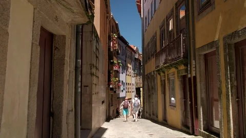 Clip of tourists walking down old narrow street in Porto, Portugal Stock Footage 120672950