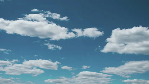 Clip of White Fluffy Clouds Over Blue Sky Video stock 121378824