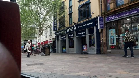 A clip of a window view of people walking on Silver Street Leicester City, UK Видео 240952204