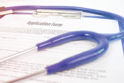 Clipboard with application form and phonendoscope. Insurance medicine concept. Stock Photos