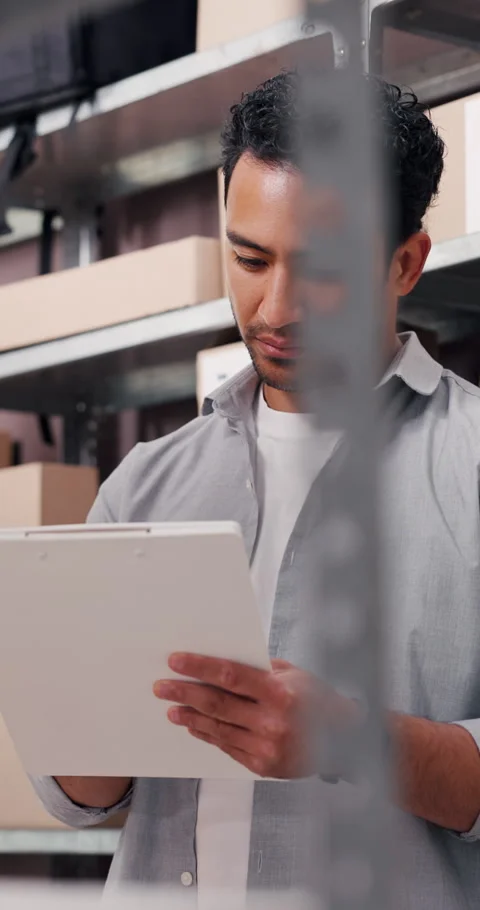Clipboard, documents and man in office with boxes for delivery, logistics and Stock Footage 332324377