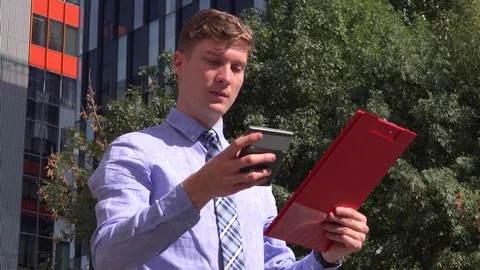 Clipboard with paperwork strategy business manager outdoors calculator working Stock Footage