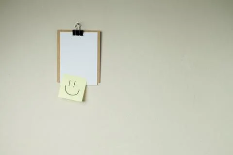 Clipboard with post it notes and smile on the wall. smile concept. clipboard  Stock Photos